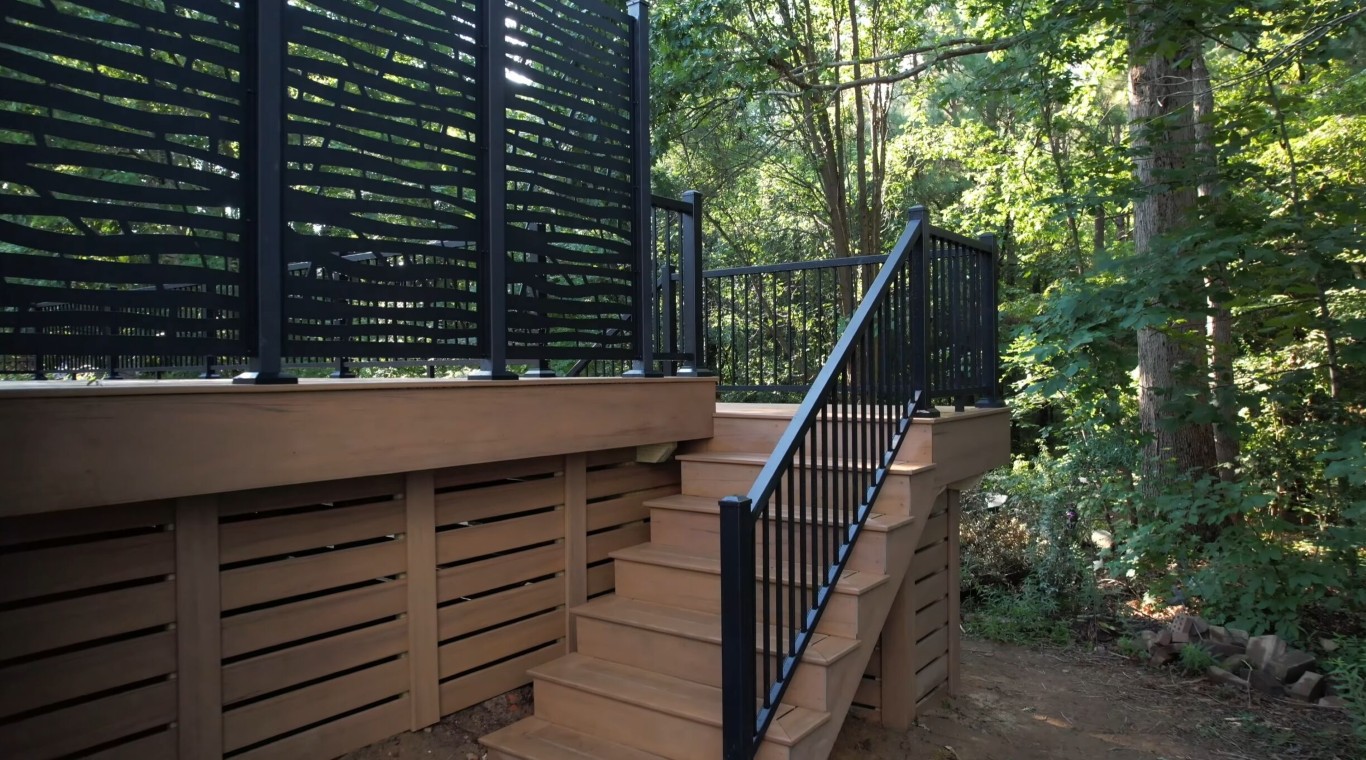 Professionally built elevated deck with safety-compliant stairs and railings