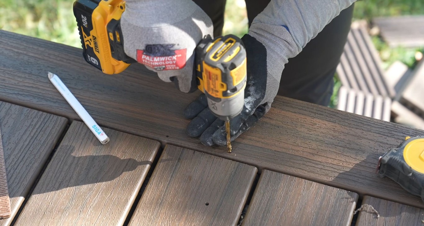 Professional deck builder installing composite decking in Upland, CA